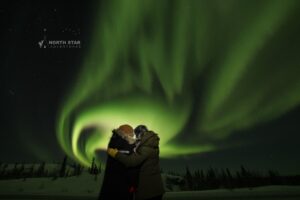 Couples enjoying a personal and private aurora hunting tour experience in Yellowknife with North Star Adventures