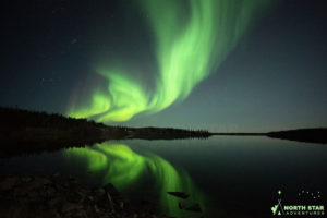 Beautiful aurora reflection in the summer in Yellowknife with North Star Adventures