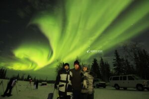 Guests enjoying amazing Aurora on North Star Adventures world famous Aurora Hunting tour in Yellowknife