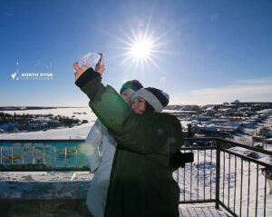 Guests taking selfie on Sightseeing City Tour in Yellowknife with North Star Adventures